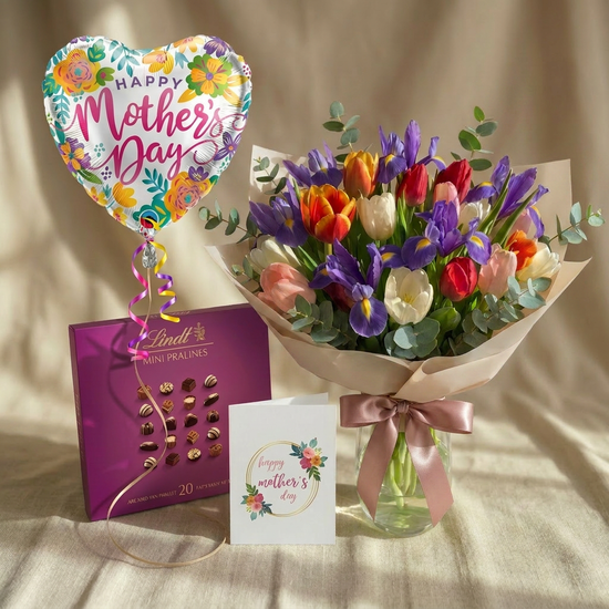 Bouquet of flowers, Lindt chocolate, and a card with a &