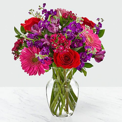 Assorted Pink, Red & Purple Flowers in a Vase